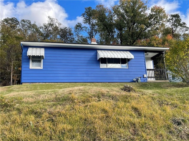 view of property exterior featuring a yard