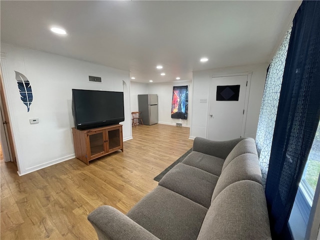 living room with light hardwood / wood-style floors