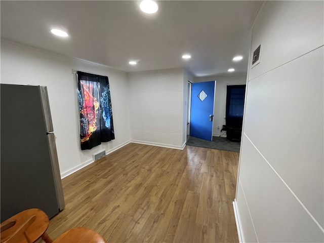 empty room with hardwood / wood-style floors