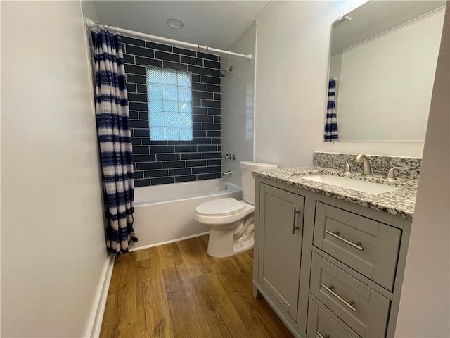 full bathroom with hardwood / wood-style flooring, shower / bath combination with curtain, toilet, and vanity