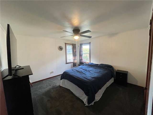 bedroom featuring ceiling fan and dark colored carpet