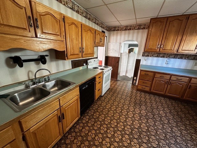 kitchen with dishwasher, sink, a paneled ceiling, and white range with electric cooktop