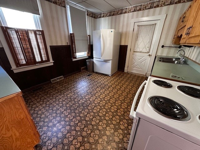 kitchen with white appliances and sink