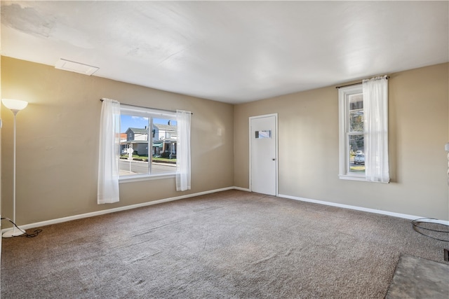 empty room with carpet flooring and baseboards