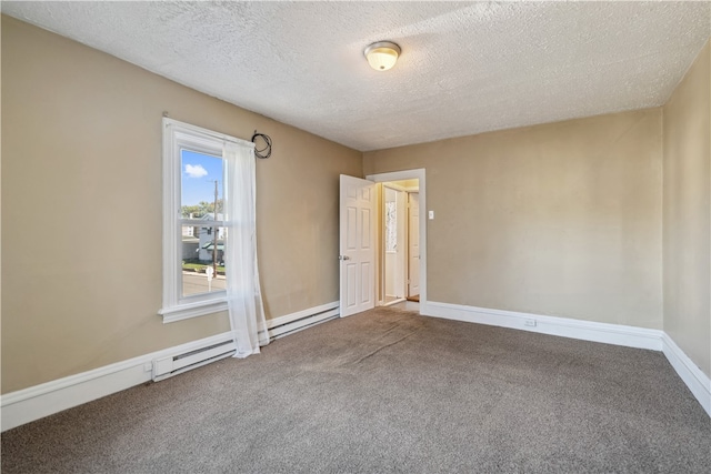 carpeted empty room with a textured ceiling and baseboards