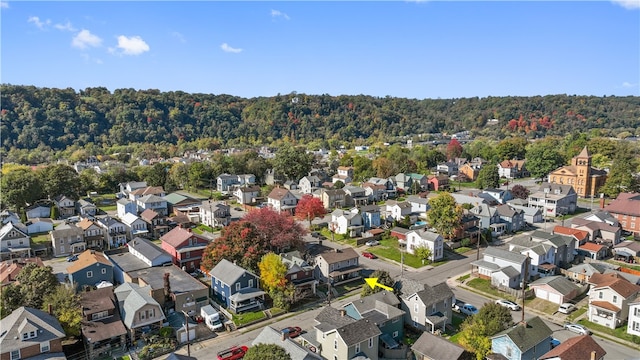 birds eye view of property featuring a residential view and a view of trees