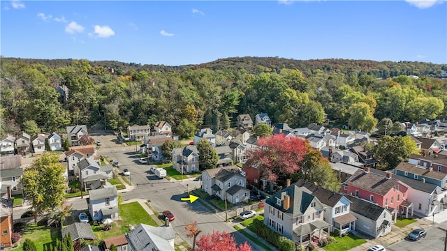 bird's eye view featuring a residential view and a view of trees