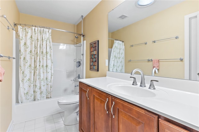 full bathroom featuring vanity, shower / bath combo with shower curtain, toilet, and tile patterned flooring