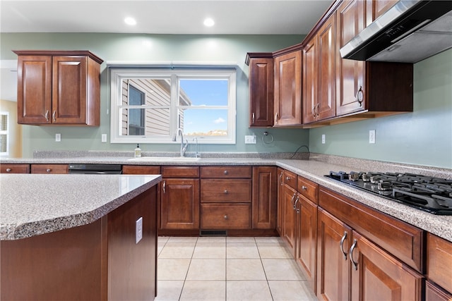 kitchen featuring sink, ventilation hood, light tile patterned floors, and black appliances