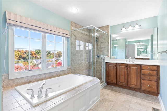 bathroom with vanity, independent shower and bath, and tile patterned flooring