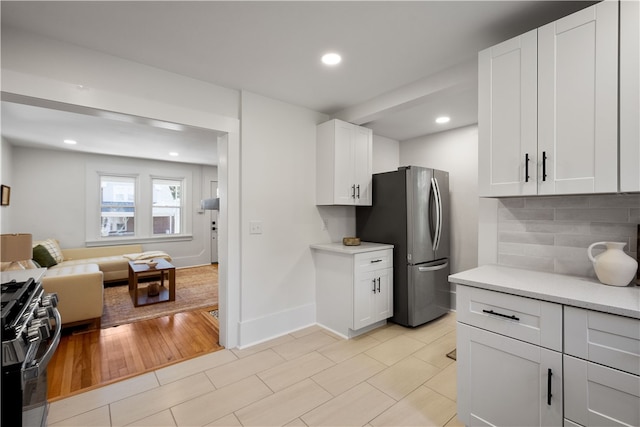 kitchen featuring white cabinets and light wood-type flooring