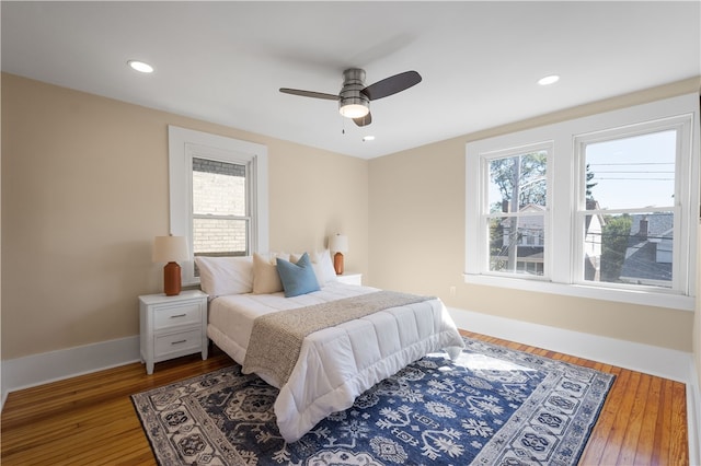 bedroom featuring ceiling fan and hardwood / wood-style flooring