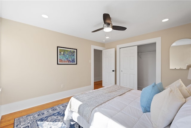 bedroom featuring a closet, ceiling fan, and hardwood / wood-style floors