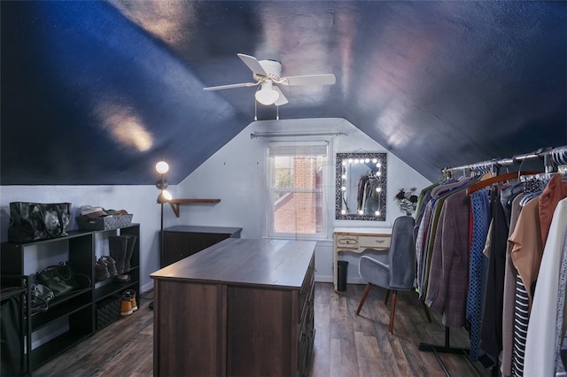 spacious closet with lofted ceiling, ceiling fan, and dark hardwood / wood-style flooring