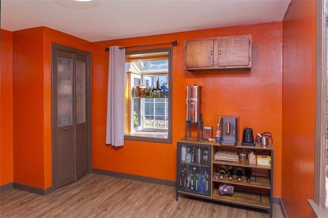 bar featuring light wood-type flooring