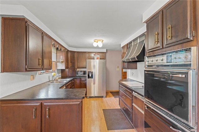 kitchen with extractor fan, light hardwood / wood-style flooring, black appliances, and sink