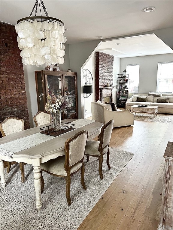 dining room featuring hardwood / wood-style flooring and an inviting chandelier