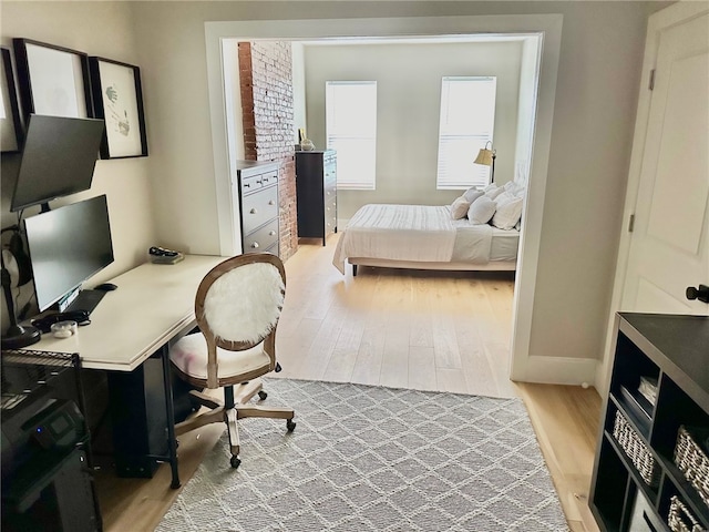 bedroom with light wood-type flooring