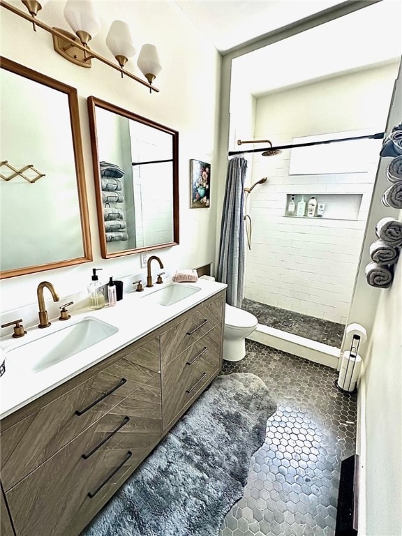 bathroom featuring vanity, a shower with curtain, toilet, and tile patterned flooring