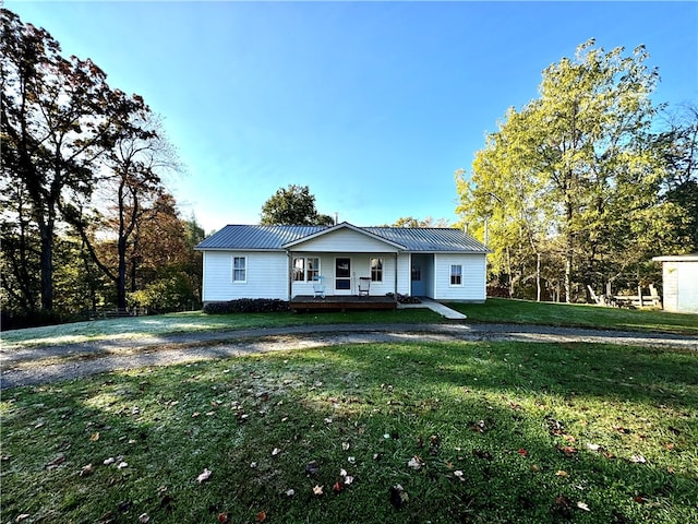 view of front of home featuring a front yard and a porch