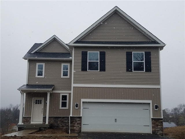 view of front of property with a garage