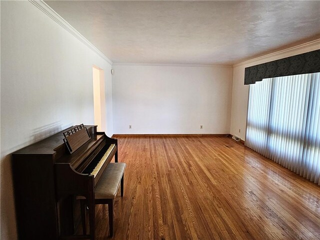 2656 Shelly Dr, White Twp Ind, PA 15701 - unfurnished living room with baseboards, wood finished floors, and crown molding