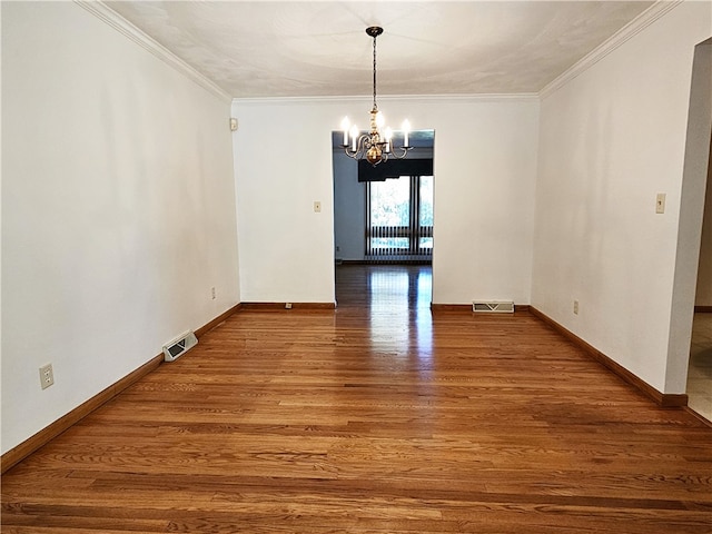 unfurnished dining area featuring wood-type flooring, an inviting chandelier, and ornamental molding