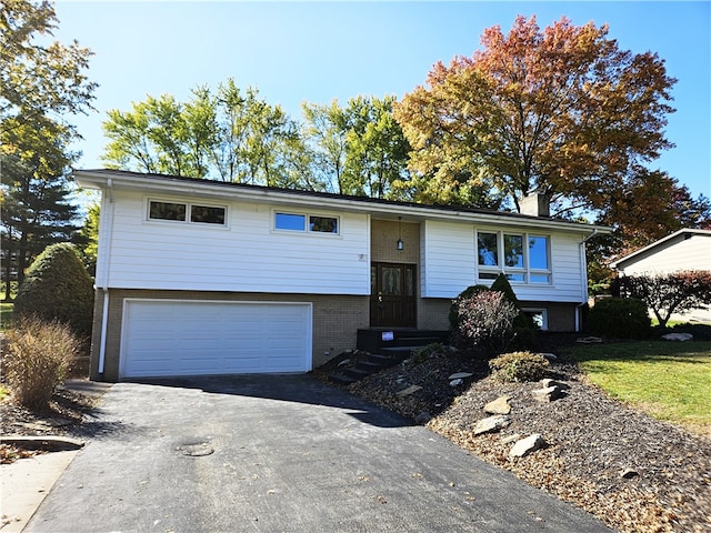 raised ranch featuring a garage