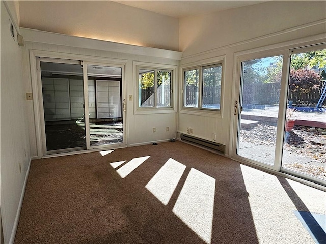 2656 Shelly Dr, White Twp Ind, PA 15701 - unfurnished sunroom with a baseboard heating unit, carpet, and a healthy amount of sunlight