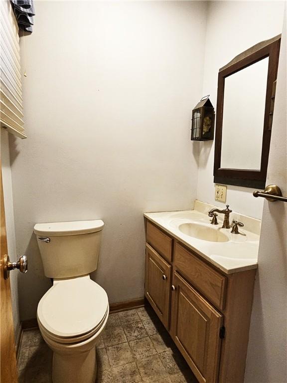 2656 Shelly Dr, White Twp Ind, PA 15701 - half bathroom with vanity, toilet, and baseboards