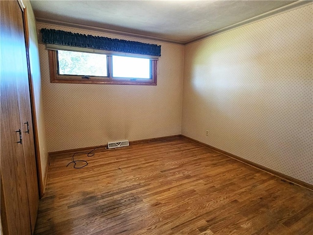 2656 Shelly Dr, White Twp Ind, PA 15701 - spare room with wood finished floors, visible vents, baseboards, and ornamental molding