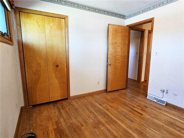 2656 Shelly Dr, White Twp Ind, PA 15701 - unfurnished bedroom featuring a closet, wood finished floors, visible vents, and baseboards