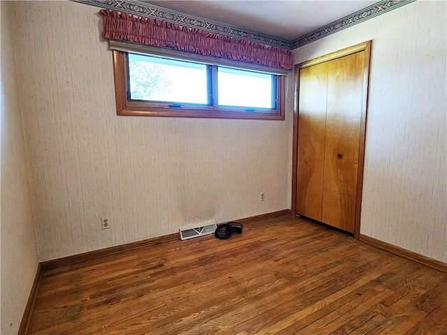 2656 Shelly Dr, White Twp Ind, PA 15701 - unfurnished bedroom with baseboards, wood finished floors, visible vents, and a closet