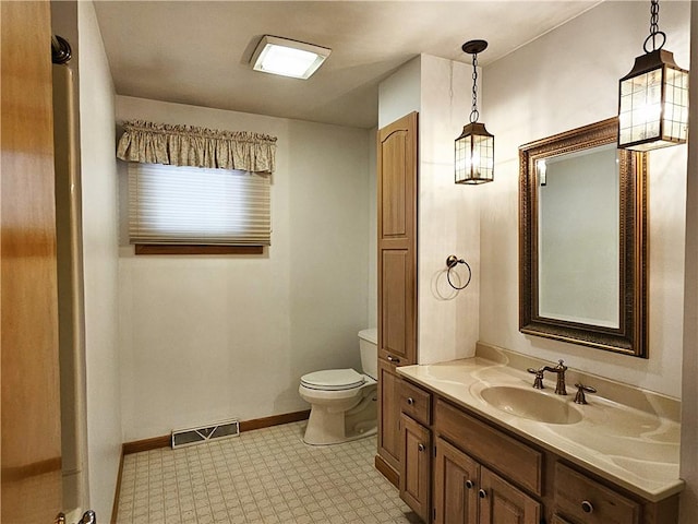 2656 Shelly Dr, White Twp Ind, PA 15701 - bathroom with tile patterned floors, toilet, baseboards, visible vents, and vanity