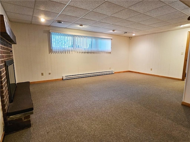 2656 Shelly Dr, White Twp Ind, PA 15701 - below grade area featuring baseboard heating, carpet floors, baseboards, a brick fireplace, and a paneled ceiling
