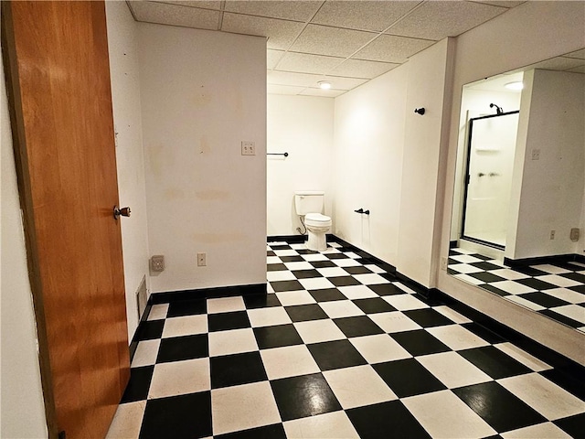2656 Shelly Dr, White Twp Ind, PA 15701 - bathroom with toilet, tile patterned floors, a paneled ceiling, and a stall shower