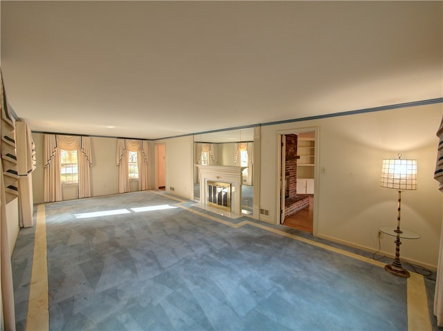 unfurnished living room featuring carpet flooring