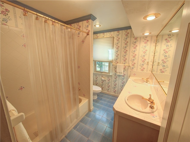 full bathroom with vanity, shower / bath combo, and toilet