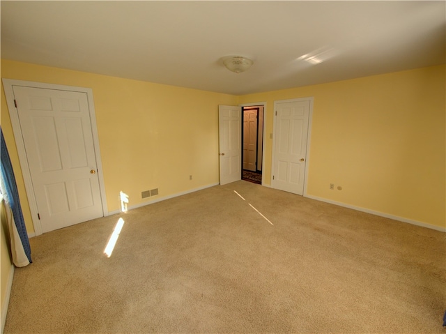 unfurnished bedroom with light carpet