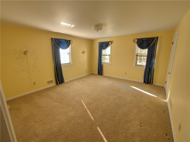 unfurnished room with carpet floors