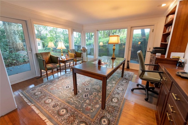 office area featuring light hardwood / wood-style flooring and ornamental molding