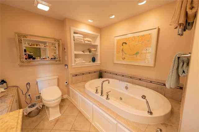 bathroom with toilet, vanity, a bath, and tile patterned flooring