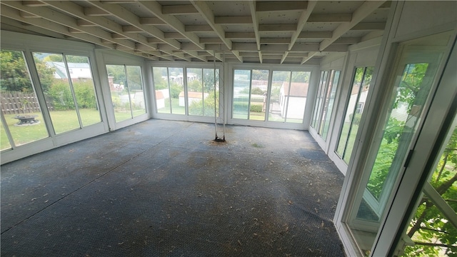 unfurnished sunroom featuring a healthy amount of sunlight