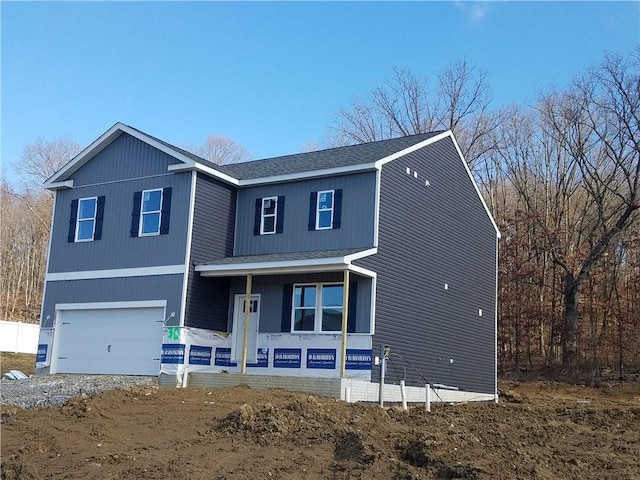 view of front of house featuring a garage and covered porch