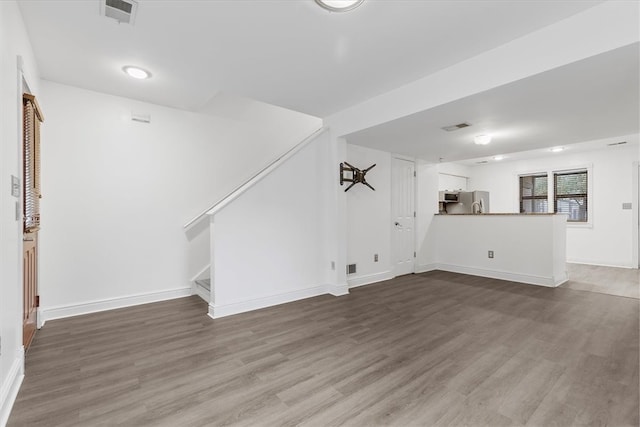 unfurnished living room with hardwood / wood-style flooring