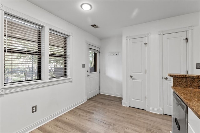 interior space with light wood-type flooring and plenty of natural light