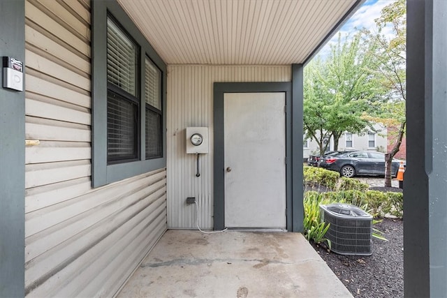 doorway to property featuring cooling unit