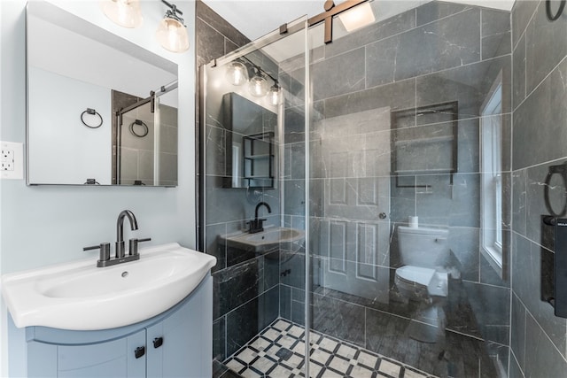 bathroom featuring vanity and a shower with shower door