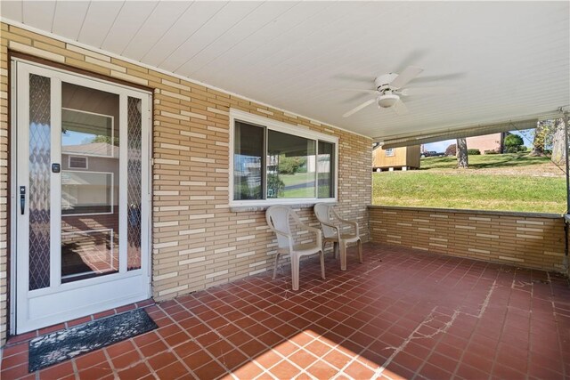 view of patio featuring ceiling fan