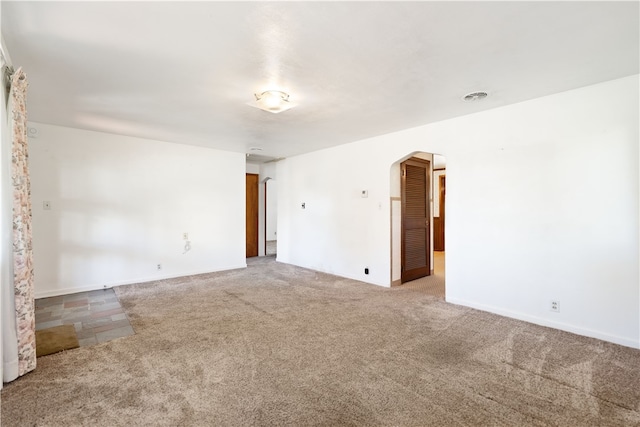 unfurnished room with carpet flooring